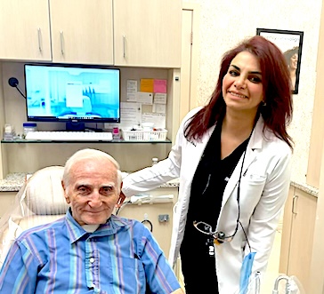Beautiful Smiles at DentalQ – Dr. Rusul with Patient Dr. Rusul Albazi smiling with a patient after dental treatment at DentalQ’s modern Chicago office, showcasing beautiful smiles and compassionate care.