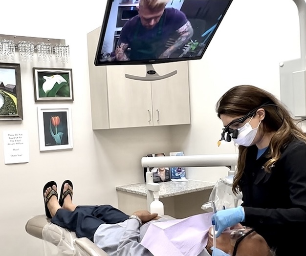State-of-the-Art Dental Technology at DentalQ Chicago Dentist in Chicago using modern dental technology with ceiling-mounted TV at DentalQ in Lincoln Park and South Loop.