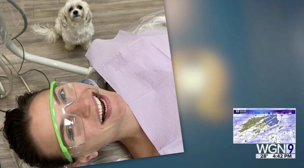 Hazel the Therapy Dog – DentalQ Chicago Comfort Dentistry Therapy dog Hazel comforting a patient during dental treatment at DentalQ in Chicago