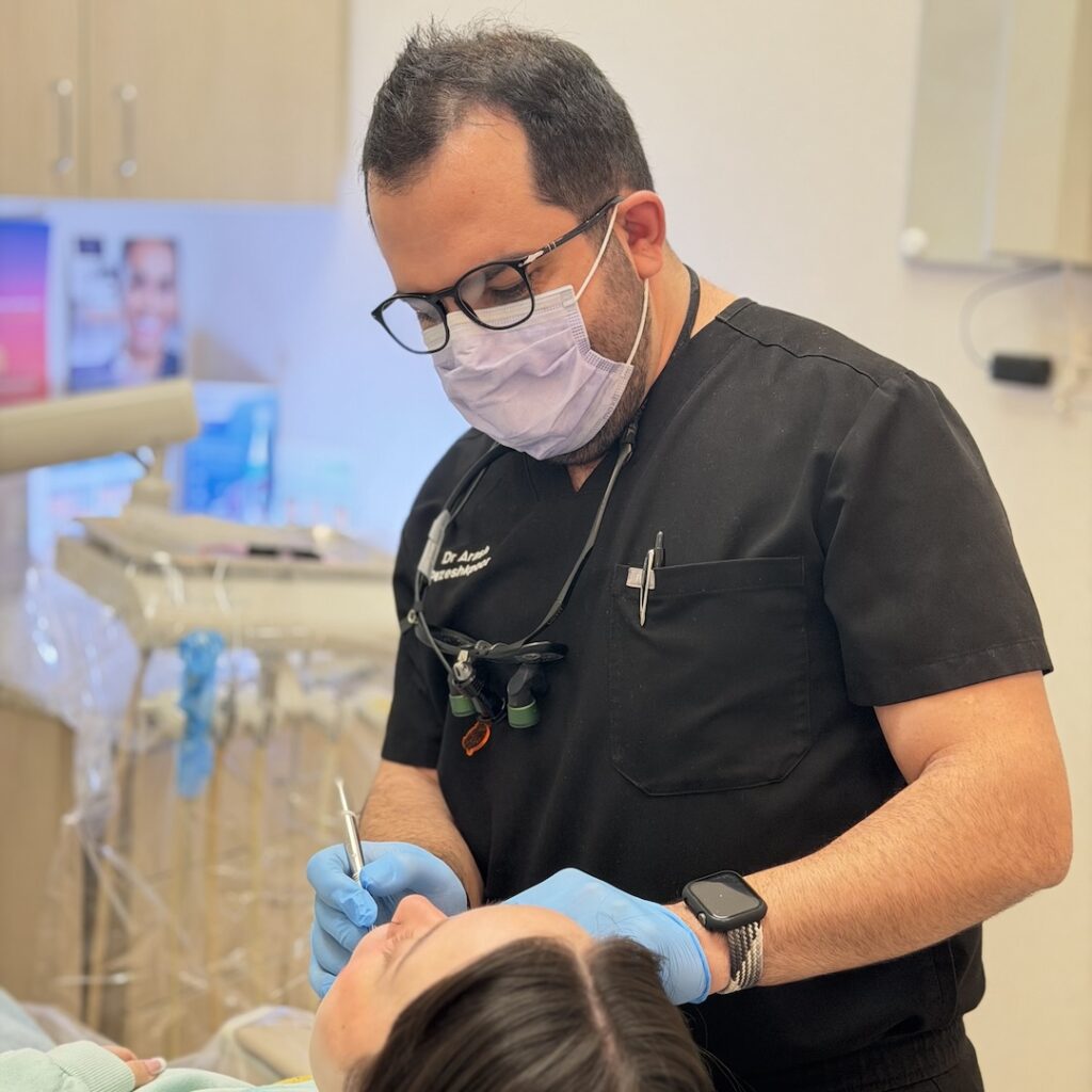 Lincoln Park Dentist Using Modern Dental Technology Dentist in Lincoln Park using advanced dental technology during treatment at DentalQ Chicago